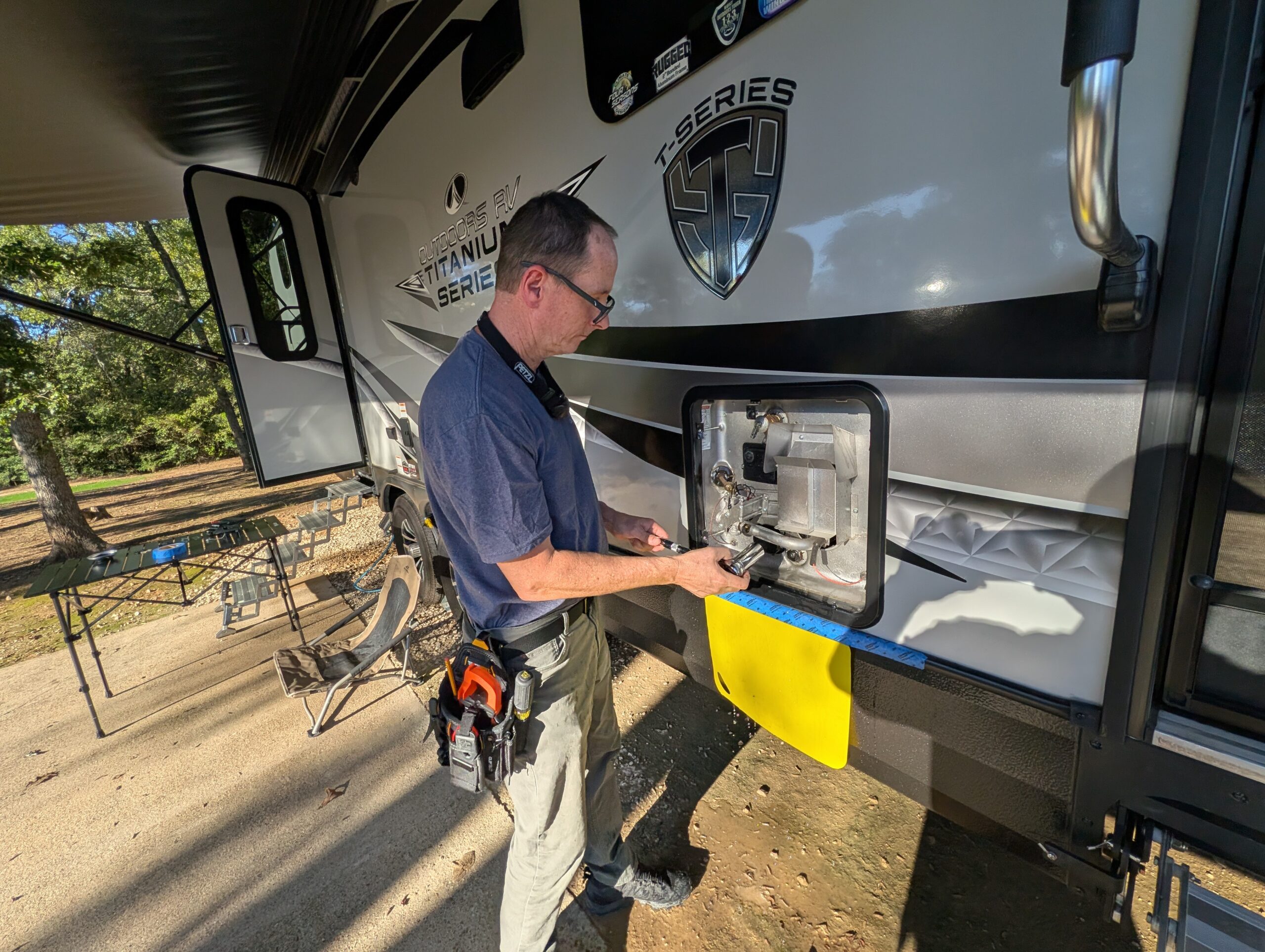 RV Tech servicing a water heater.